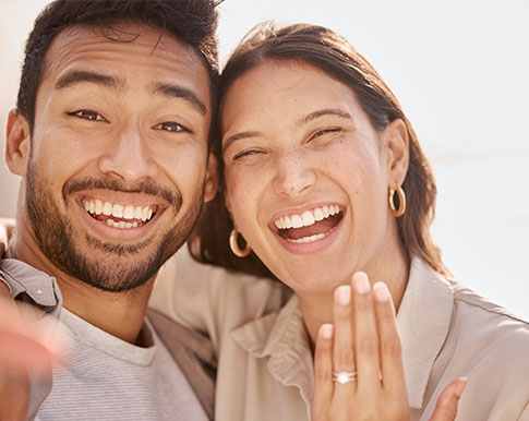 Griffeth and Sarah Whitehurst embrace on the mezzanine of Whitehurst Gallery.
